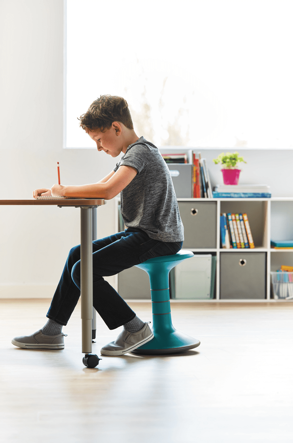 Child sitting on ricochet wobble stool